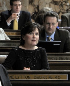 Kristine Lytton at her desk on the House Floor during the first day of the 2011 legislative session.